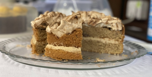 Coffee and walnut cake on a glass plate